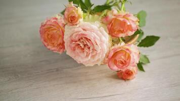 bouquet of beautiful roses on a wooden table video