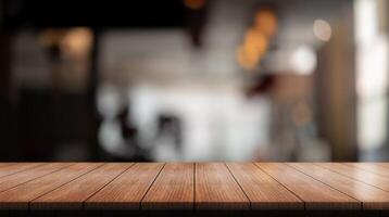Empty wooden table top with lights bokeh on blur restaurant background. photo