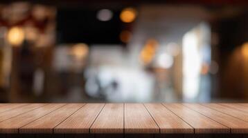 Empty wooden table top with lights bokeh on blur restaurant background. photo