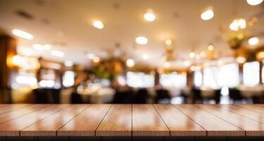 Empty wooden table top with lights bokeh on blur restaurant background. photo