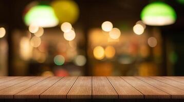 Empty wooden table top with lights bokeh on blur restaurant background. photo