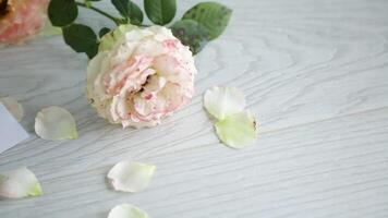 bouquet of beautiful roses on a wooden table video