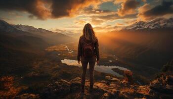 AI generated One person hiking mountain peak at sunrise generated by AI photo