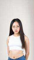AI generated photo of beautiful young asian woman with crop white top and jeans an glasses standing at white backdrop, generative AI