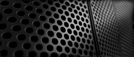 AI generated Macro shot of a black perforated metal surface with circular patterns photo