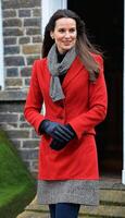 AI generated photo of beautiful happy lady europe woman with red coat and scarf standing at garden, generative AI