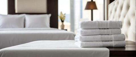 AI generated Set of clean white towels set stacked on bed in hotel room, leisure, vacation and travel concept, template, background, banner with copy space area photo