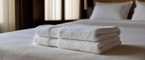 AI generated Set of clean white towels set stacked on bed in hotel room, leisure, vacation and travel concept, template, background, banner with copy space area photo
