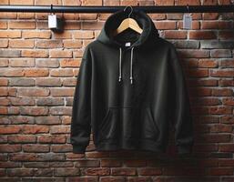 AI generated Blank black hoodie isolated on brick wall, empty hoodie mock up template, fashion and clothing background photo