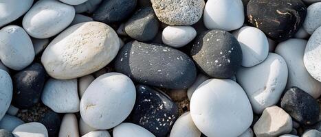 AI generated Close-up of mixed white, grey, and black pebbles photo