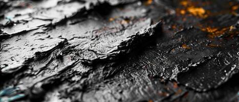 AI generated Macro photography of textured black paint with hints of orange photo