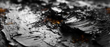 AI generated Macro photography of textured black paint with hints of orange photo