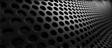 AI generated Macro shot of a black perforated metal surface with circular patterns photo