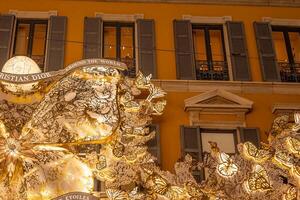 MILAN, ITALY December 4, 2023 A Dior store at the street Monte Napoleone. Christmas Street Decorated for Christmas. Fashion district. photo