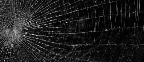 AI generated Spiderweb Crack on Dark Surface photo