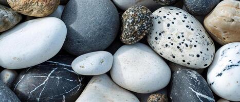 AI generated A diverse collection of patterned pebbles in white, gray, and black photo