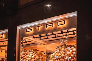 Etro store in Milan. Montenapoleone area. Fashion week shopping. Montenapoleone fashion district in downtown Luxury shop boutique windows for Christmas decorations. Milan, Italy December 6, 2023. photo