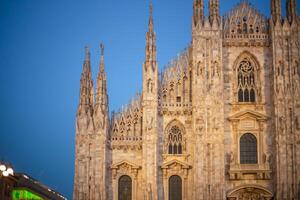 Christmas holiday tree near the Duomo in Milan. Piazza del Duomo. Duomo square in december, night view photo