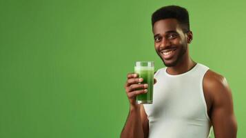 AI generated Healthy man holding vegetable juice on green background photo