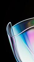 AI generated Close up of holographic glass shapes with dark background and colorful reflections. Abstract pattern wallpaper. Texture with nice glossy effect. photo