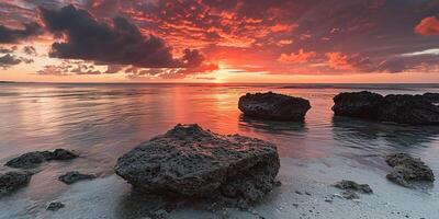 ai generado genial barrera arrecife en el costa de queensland, Australia rocoso playa marina. rocas y guijarros, púrpura y naranja dorado hora puesta de sol noche cielo horizonte mar fondo de pantalla antecedentes foto