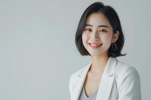 AI generated a confident young lady wearing white blazer smiling lively in isolated plain studio background photo