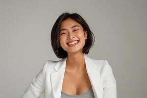 AI generated a confident young lady wearing white blazer smiling lively in isolated plain studio background photo