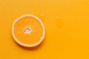 slice of orange in yellow surface aerial view photo