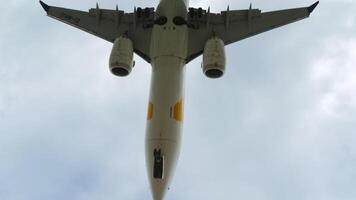 PHUKET, THAILAND - JANUARY 27, 2023. Boeing 737 MAX 8, EI-MNG of MIAT Mongolian Airlines landing at Phuket airport, overhead. Passenger airliner flies over Mai Khao Beach. Travel concept video