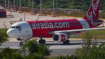 PHUKET, THAILAND - NOVEMBER 26, 2016. Passenger jet AirAsia taxiing on the runway. Airbus A320, HS-BBS ready to take off at Phuket Airport. Tourism and travel concept video