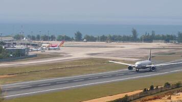 PHUKET, THAILAND - FEBRUARY 23, 2023. Passenger jet plane Boeing 777 of Aeroflot taking off at Phuket airport. Travel concept video