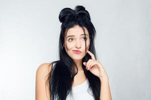 Portrait of young woman with shocked facial expression photo