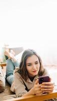 Digital Connection. Smiling Young Woman Engaged in Smartphone Typing, Social Network Chatting, and Internet Surfing. Modern Communication and Social Media Lifestyle Concept photo