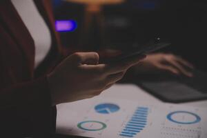 Business woman using calculator for do math finance on wooden desk in office and business working background, tax, accounting, statistics and analytic research concept photo