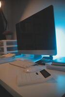 Laptop and paperwork on conference table photo