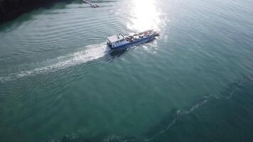 Many fishing boats near the seashore in tropical islands. Pier of the villagers on the southern island of Thailand. top view from drones. video