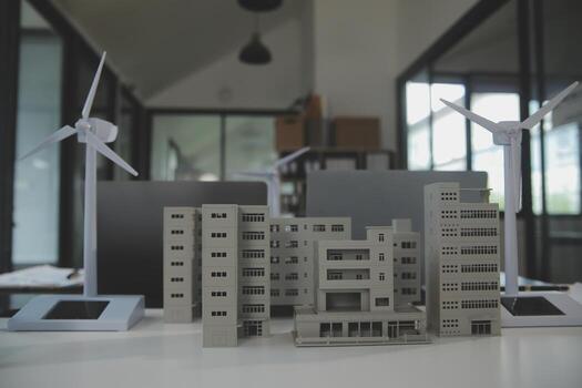 Close-up at tablet, Engineers pointing at tablet with their hands. To jointly design the use of renewable energy with wind and solar energy. Concept of using renewable energy. photo