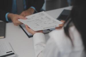 Close up view of job interview in office, focus on resume writing tips, employer reviewing good cv of prepared skilled applicant, recruiter considering application, hr manager making hiring decision photo