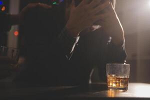 Celebration night, pour whiskey into a glass. Give to friends who come to celebrate photo