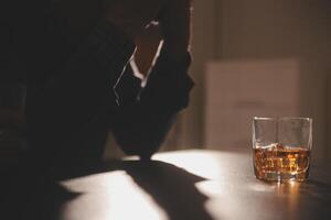 Celebration night, pour whiskey into a glass. Give to friends who come to celebrate photo