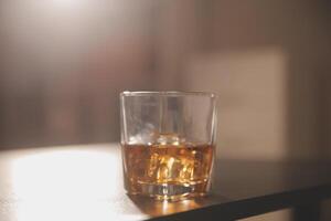 Celebration night, pour whiskey into a glass. Give to friends who come to celebrate photo