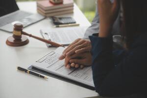 Lawyer, legal advisor, businessman brainstorming information on agreement details Business contracts in legal processing books for accuracy in contract documents. joint financial investment. photo