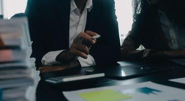 Finance manager meeting discussing company growth project success financial statistics, professional investor working start up project for strategy plan with document, laptop and digital tablet. photo