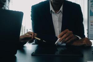 Finance manager meeting discussing company growth project success financial statistics, professional investor working start up project for strategy plan with document, laptop and digital tablet. photo