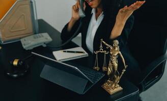 Judge gavel with Justice lawyers having team meeting at law firm background. Concepts of Law and Legal services. photo