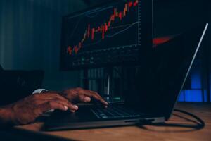 Thoughtful focused successful caucasian male stock investor, broker, financial adviser, sits at work desk, looks at computer, pensively analyze risks and prospects, rise or fall of cryptocurrency coin photo