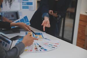 Close up ux developer and ui designer use augmented reality brainstorming about mobile app interface wireframe design on desk at modern office.Creative digital development agency photo