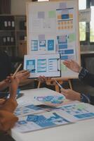 Close up ux developer and ui designer use augmented reality brainstorming about mobile app interface wireframe design on desk at modern office.Creative digital development agency photo