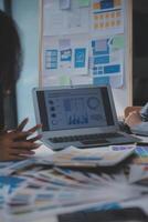 Close up ux developer and ui designer use augmented reality brainstorming about mobile app interface wireframe design on desk at modern office.Creative digital development agency photo