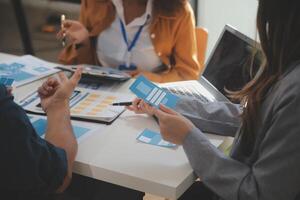 Close up ux developer and ui designer use augmented reality brainstorming about mobile app interface wireframe design on desk at modern office.Creative digital development agency photo